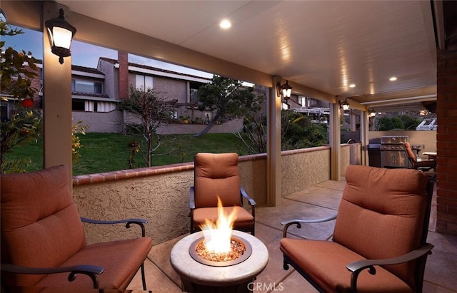 view of patio with a fire pit and grilling area