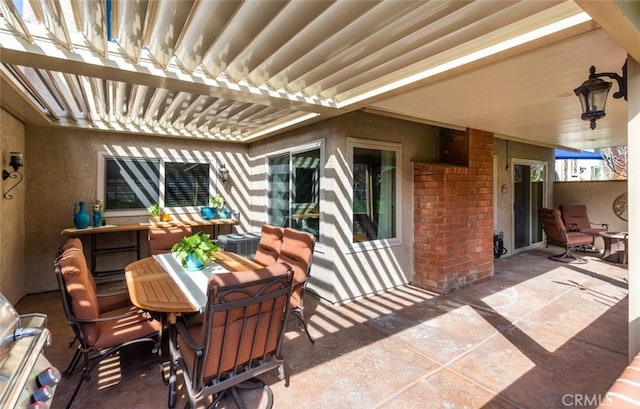 view of patio with outdoor dining space and a pergola