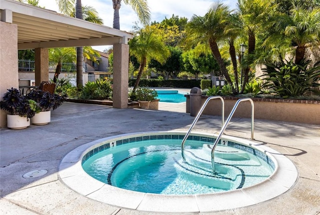 pool featuring a community hot tub