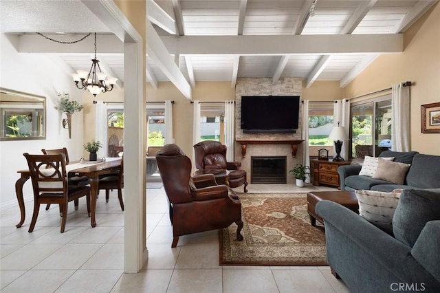 living room with light tile patterned floors, vaulted ceiling with beams, a fireplace, and an inviting chandelier