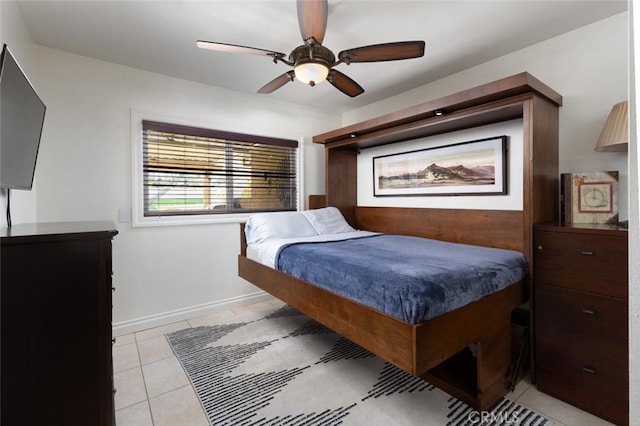 bedroom featuring ceiling fan, baseboards, and light tile patterned flooring