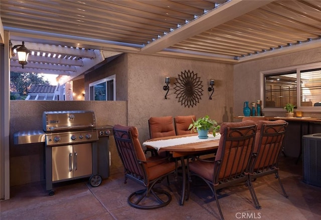 view of patio with an outdoor kitchen, cooling unit, area for grilling, a pergola, and outdoor dining space