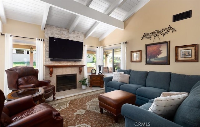 carpeted living room featuring wooden ceiling, visible vents, vaulted ceiling with beams, and a stone fireplace