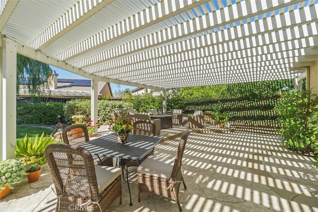 view of patio / terrace featuring a pergola and outdoor dining space