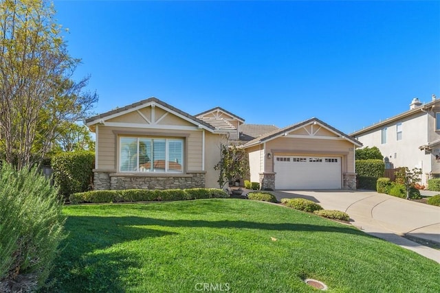 craftsman-style home featuring an attached garage, stone siding, a front lawn, and concrete driveway