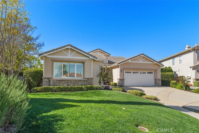 craftsman house featuring concrete driveway, stone siding, a front lawn, and a garage