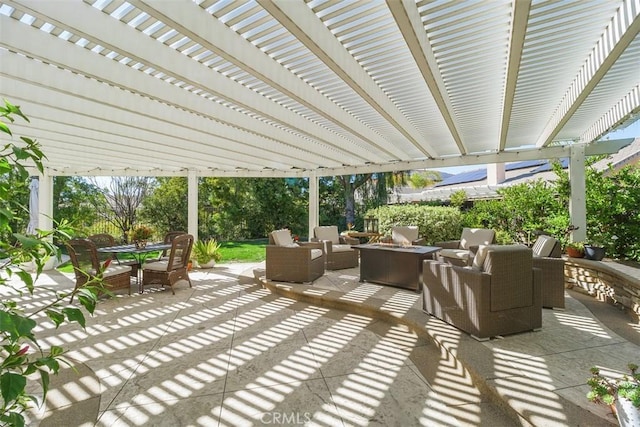 view of patio featuring an outdoor living space with a fire pit, a pergola, and outdoor dining space