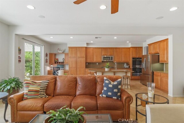 living room with visible vents, recessed lighting, and ceiling fan