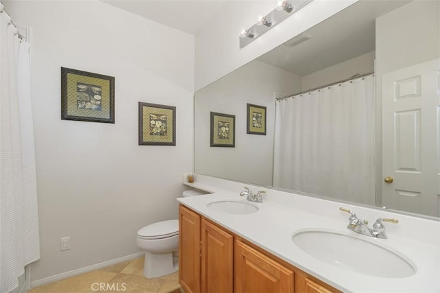 full bath with double vanity, toilet, baseboards, and a sink
