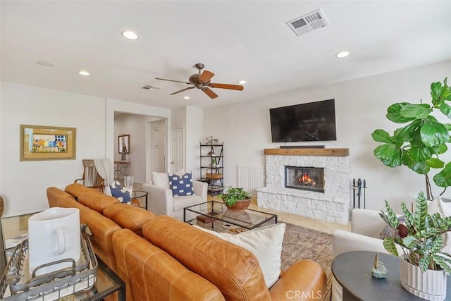 living area with ceiling fan, a fireplace, visible vents, and recessed lighting