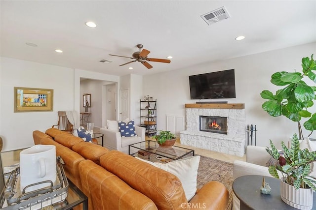 living room with visible vents, a fireplace, and recessed lighting