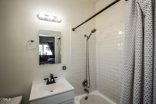 bathroom featuring toilet, vanity, and shower / tub combo with curtain