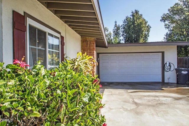 garage featuring driveway