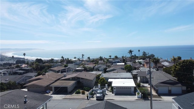 birds eye view of property featuring a water view and a residential view