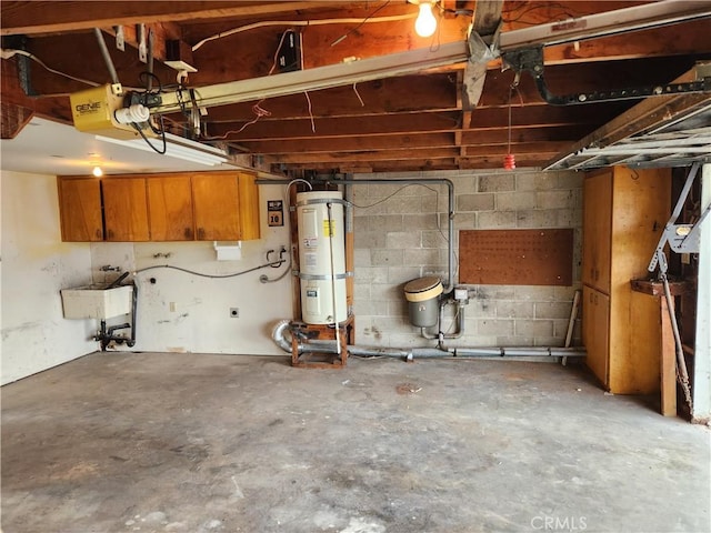 garage with secured water heater, a sink, and a garage door opener