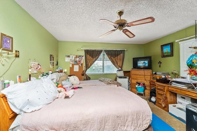 bedroom with carpet floors, a textured ceiling, and a ceiling fan