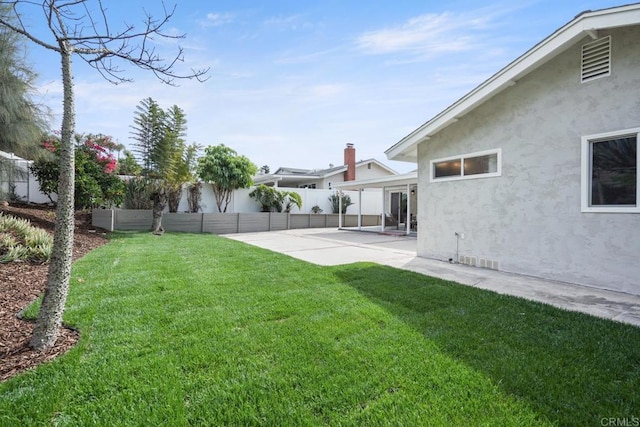 view of yard with a patio and a fenced backyard