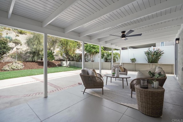 view of patio with outdoor lounge area, a fenced backyard, and a ceiling fan