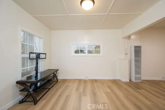 interior space with light wood-type flooring and baseboards