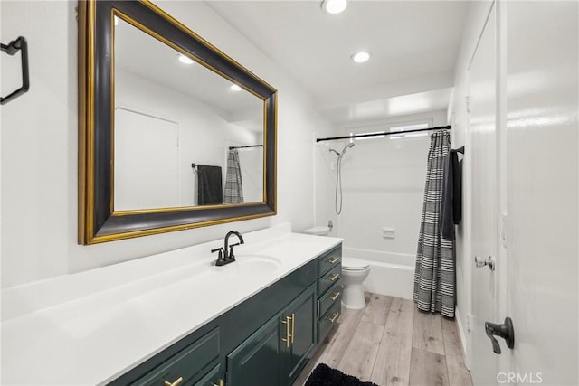 full bath featuring recessed lighting, toilet, shower / tub combo, vanity, and wood finished floors