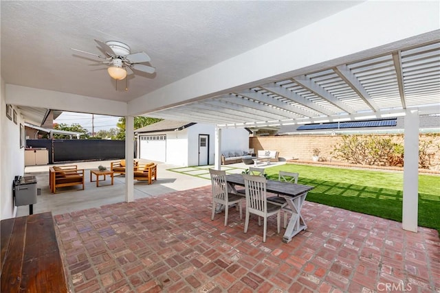 view of patio featuring an outbuilding, fence, an outdoor living space, a pergola, and outdoor dining space