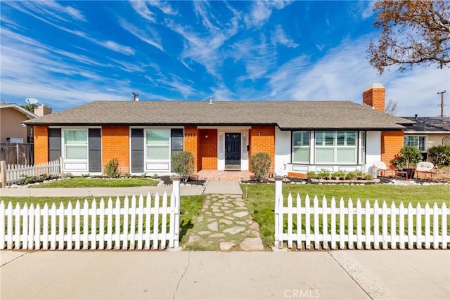 ranch-style house with a front yard, brick siding, fence, and a chimney