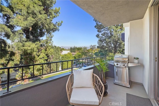 balcony featuring area for grilling