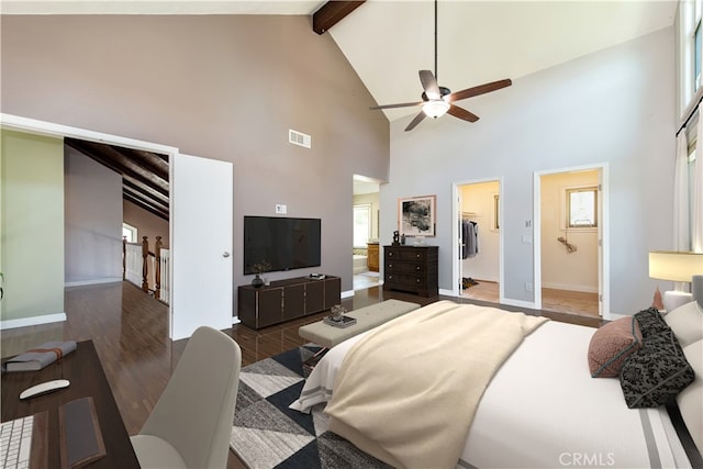 bedroom featuring beam ceiling, visible vents, multiple windows, and wood finished floors