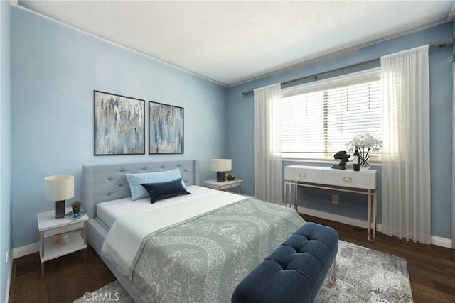 bedroom with baseboards and wood finished floors