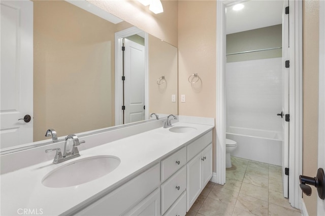 full bath with washtub / shower combination, a sink, toilet, and double vanity