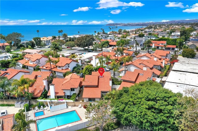bird's eye view featuring a water view and a residential view