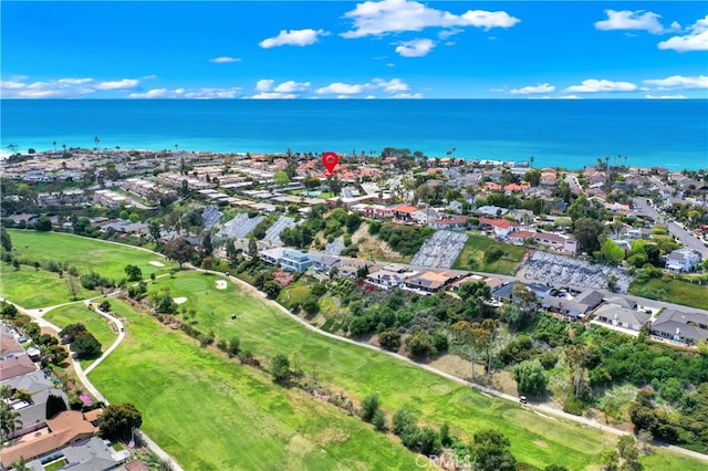 birds eye view of property featuring golf course view, a water view, and a residential view