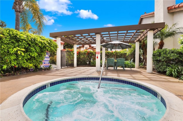 view of swimming pool featuring a pergola, fence, a community hot tub, and a patio area