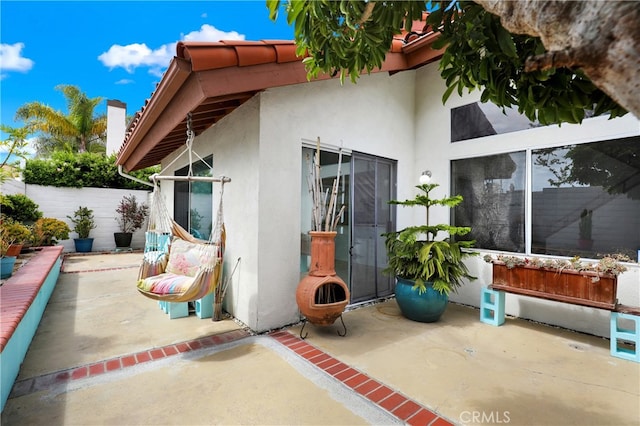 view of patio / terrace featuring fence