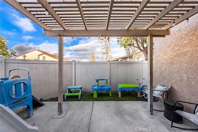 view of patio / terrace featuring a fenced backyard and a pergola