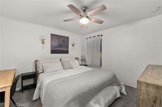 bedroom with ceiling fan, baseboards, and carpet flooring