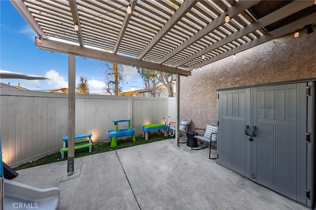 view of patio / terrace featuring a fenced backyard and a pergola