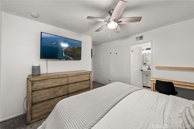 bedroom with carpet floors, visible vents, ceiling fan, ensuite bath, and baseboards