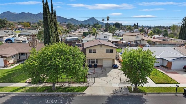 birds eye view of property with a mountain view and a residential view