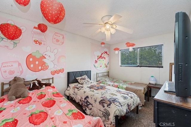 bedroom featuring a textured ceiling, ceiling fan, and carpet flooring