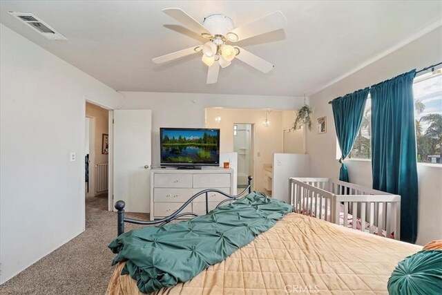 bedroom with visible vents, a ceiling fan, and carpet