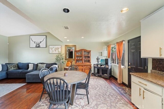 dining area featuring recessed lighting, visible vents, and wood finished floors