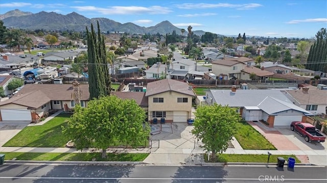 birds eye view of property featuring a mountain view and a residential view