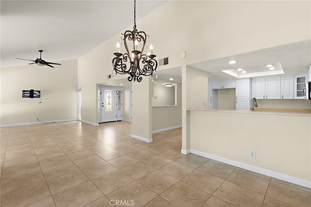 interior space featuring visible vents, baseboards, light tile patterned flooring, ceiling fan with notable chandelier, and recessed lighting