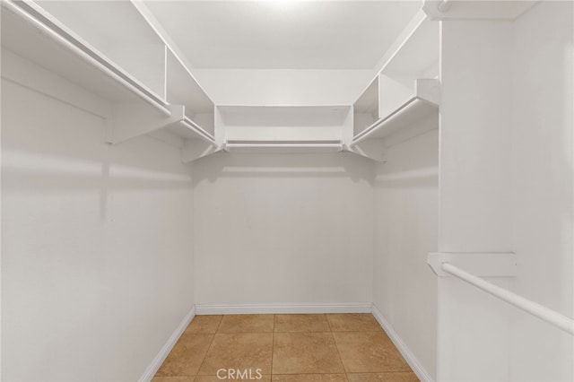 walk in closet featuring light tile patterned floors