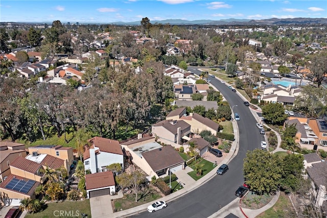 drone / aerial view with a residential view and a mountain view