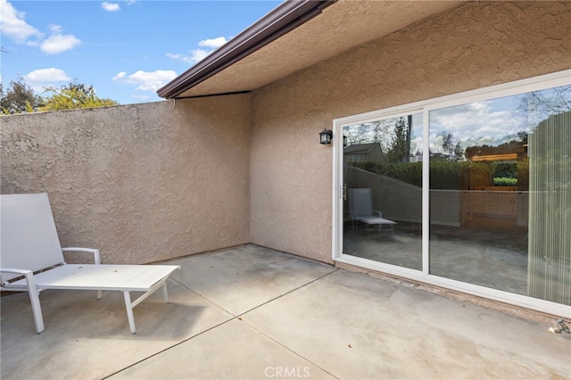 view of patio featuring fence