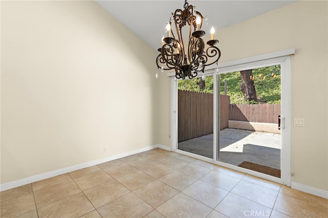 interior space featuring baseboards, a chandelier, vaulted ceiling, and light tile patterned flooring