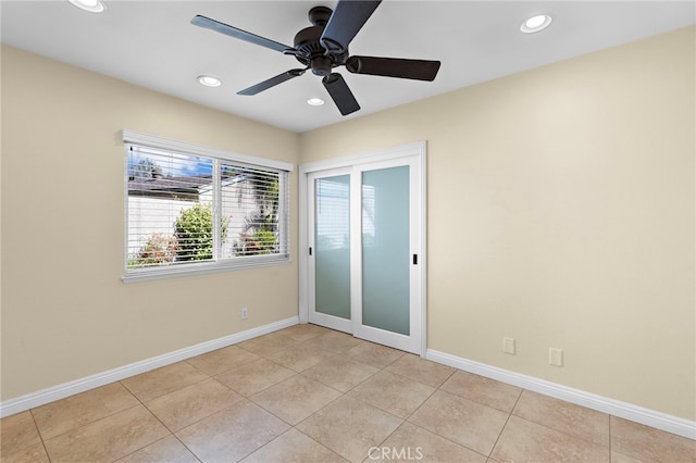 spare room with light tile patterned floors, ceiling fan, recessed lighting, and baseboards