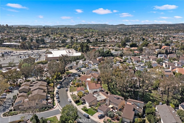 aerial view featuring a mountain view and a residential view